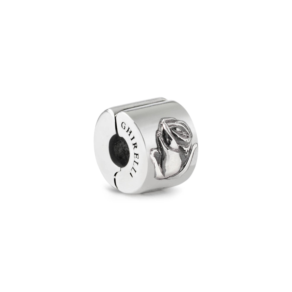 A sterling silver charm featuring a floral design, possibly a rose, with engravings and decorative elements.