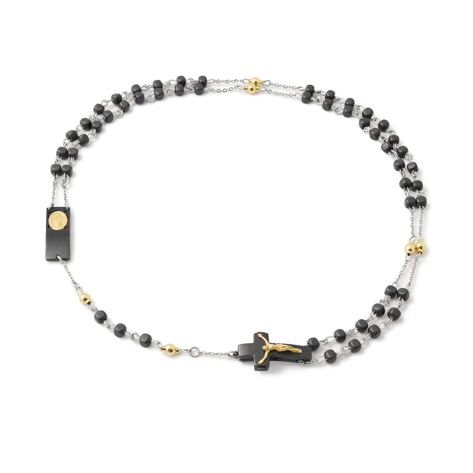 A necklace featuring black rhodium-plated square matte hematite beads and gold-plated beads, with a sterling silver crucifix and a gold-plated miraculous medal.
