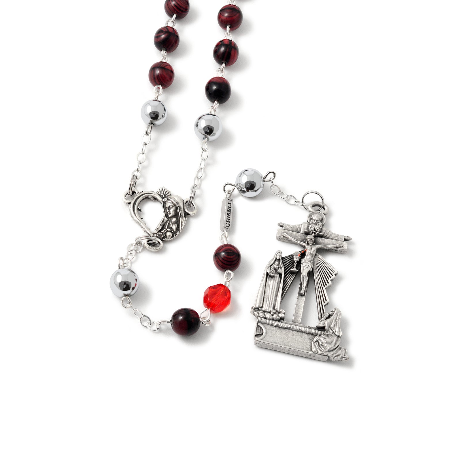 A detailed image of a rosary featuring red and silver beads, with a centerpiece depicting the Immaculate Heart of Mary and a vision of Sister Lucia of Fatima. It includes a Crucifix and isantique silver finish.