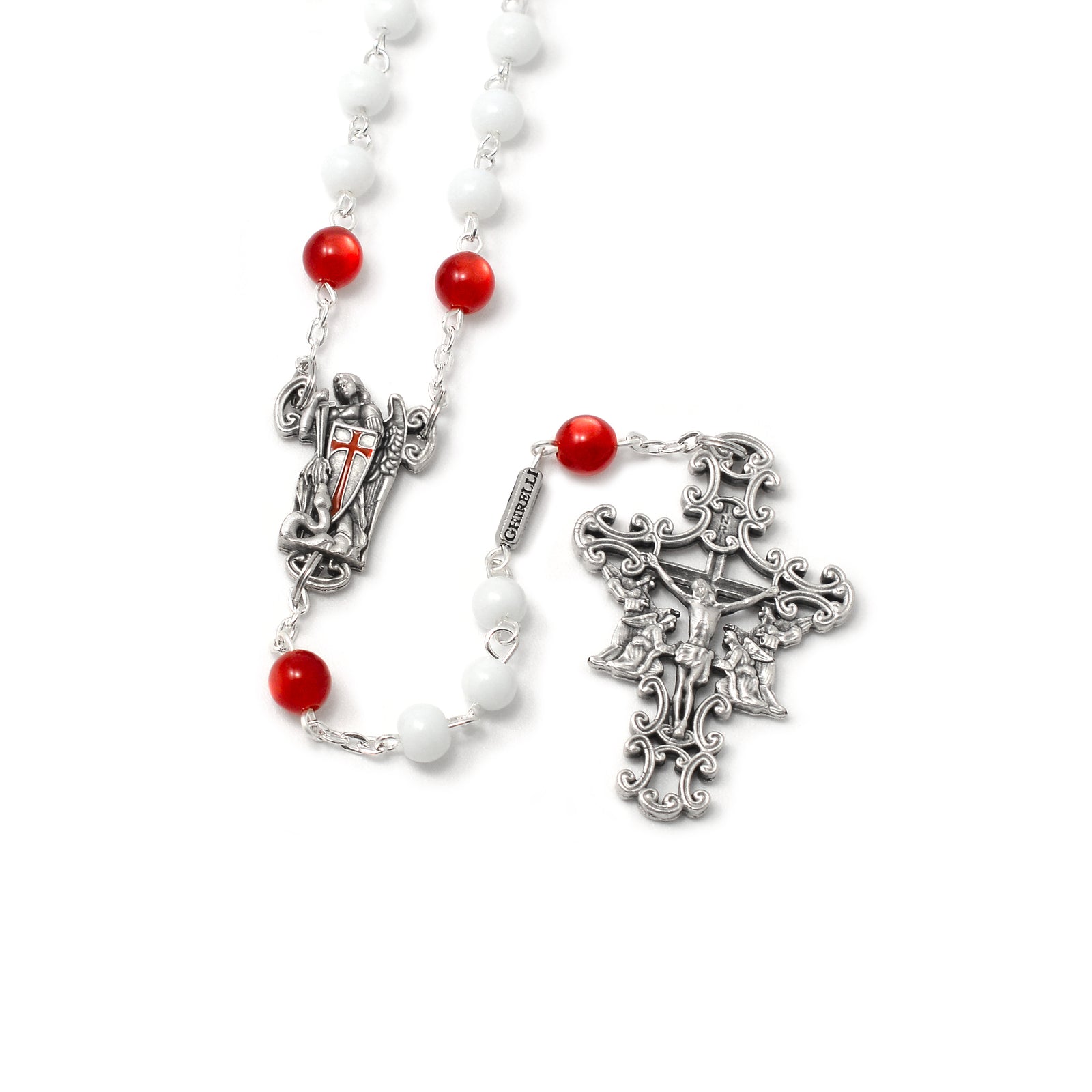 A detailed image of a Saint Michael Rosary with white and red beads, ornate Crucifix and a centerpiece statue of St. Michael the Archangel.