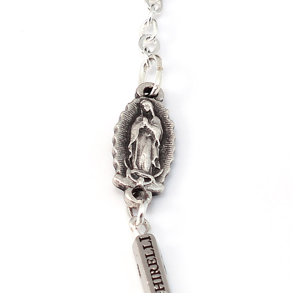 Catholic bracelet featuring Guadalupe medals and Castilian rosebud detail
