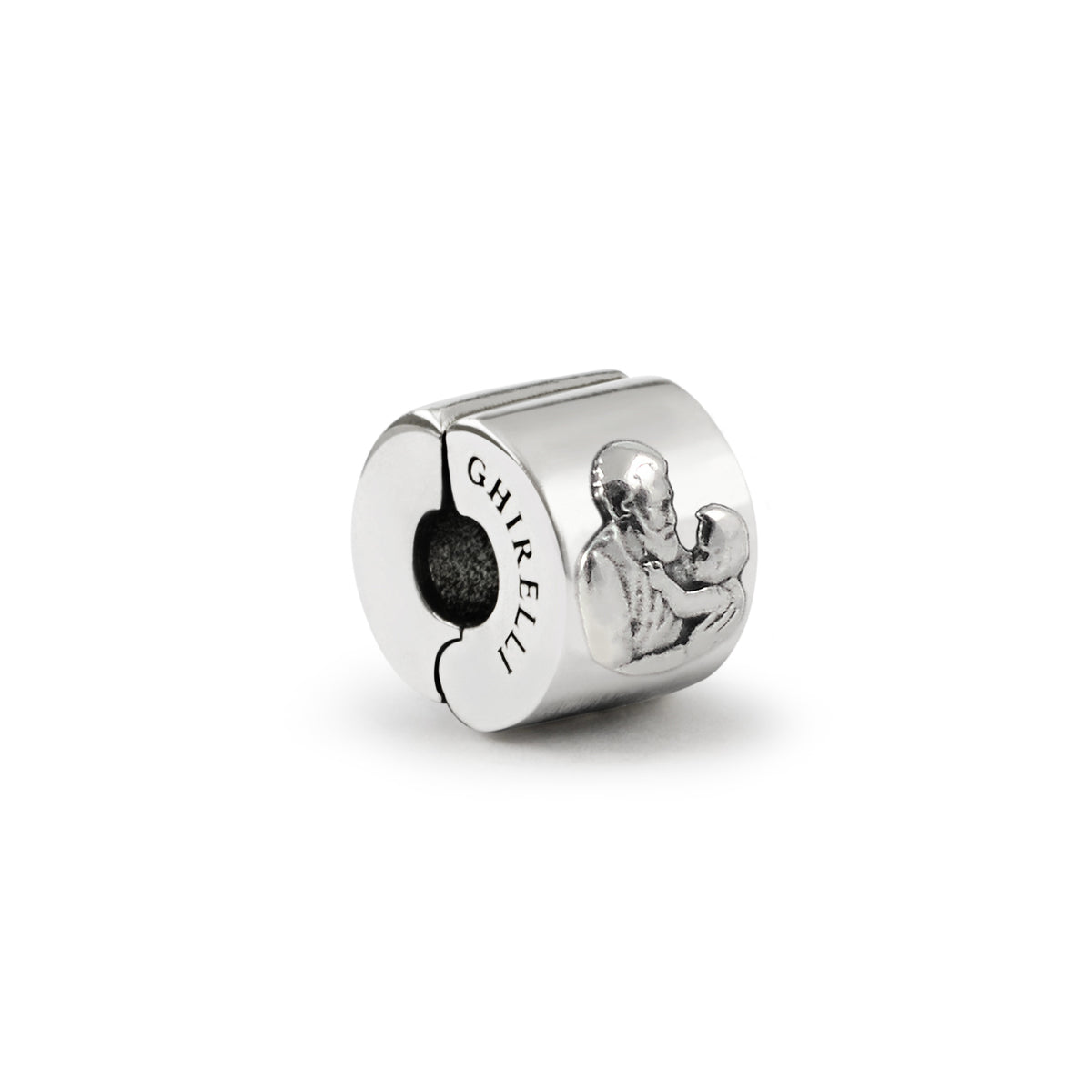 A sterling silver charm featuring an image of St. Joseph holding the Child Jesus, with the designer&#39;s signature &#39;GHIRLELLI&#39; engraved on the side.