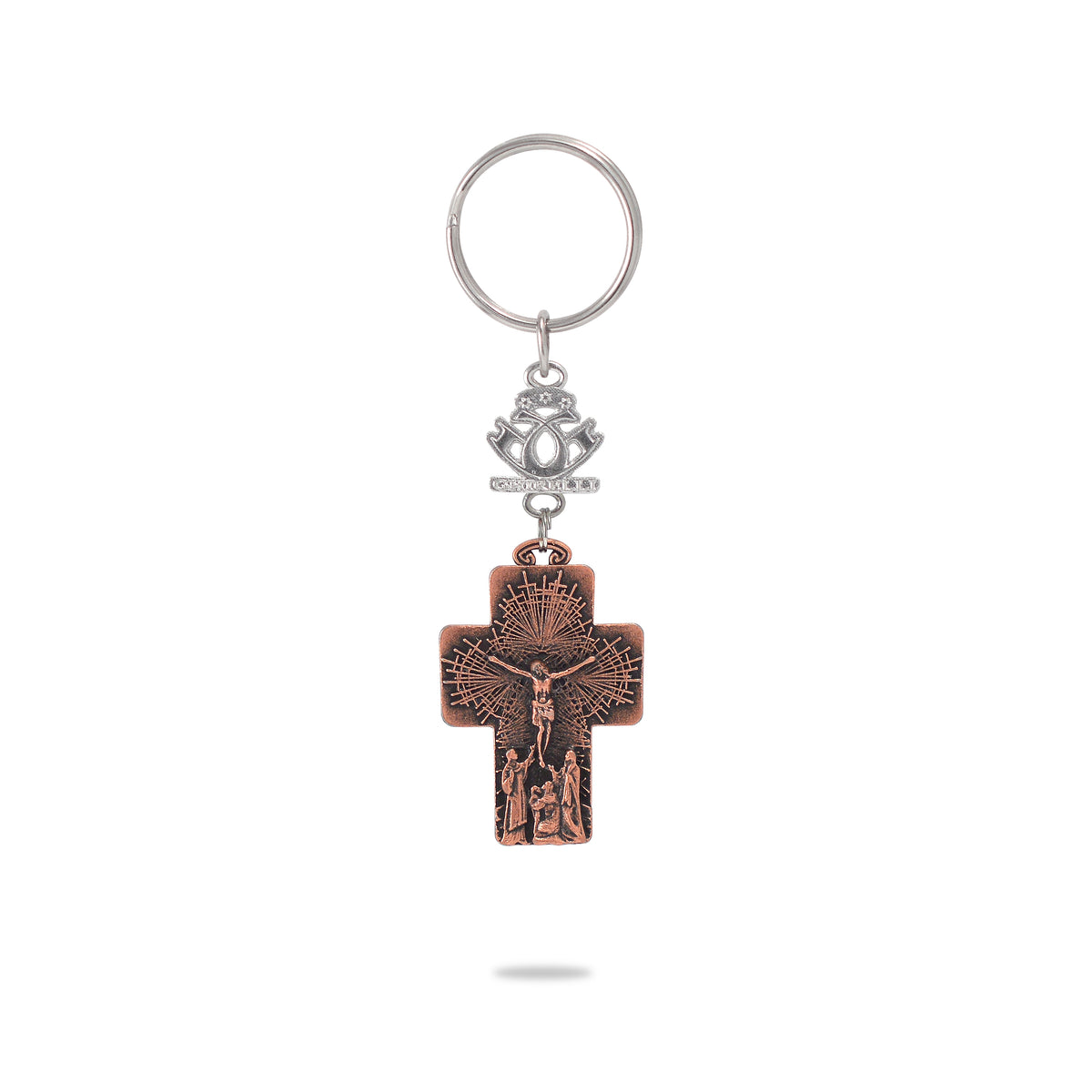 A key chain featuring a bronze-colored metal crucifix with the figure of Jesus Christ on it, attached to a ring and a decorative emblem.